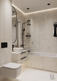 a white bathroom with a toilet, sink and bathtub in the middle of it