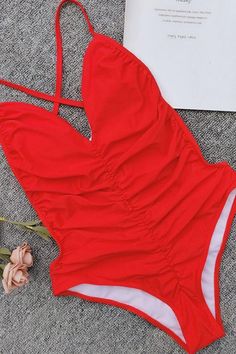 Charming one piece swimsuit featuring a v neckline with ruched front, a low back with X string, and scrunch bikini bottom with high cut leg trim. Allover in solid color.Size Guide:Size (in)USBustWaistHipS4-628-3124-2631-33M8-1031-3525-2833-36L12-1435-3727-3036-38 Swimsuit Sale, High Leg, High Cut, Low Back, One Piece Swimsuit, Tankini, Open Back, Size Guide, Solid Color