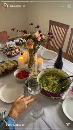 a table is set with food and candles