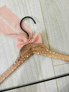 Our pearl hangers are elegant and stylish- made for displaying your wedding attire in style. Hangers are handcrafted to ensure that each piece is unique in its own way! Our hangers are laser engraved. Leaving the personalized name a dark brown color. With adhesive pearls added to create the elegant appearance. Pearls are completely optional to you! Our hangers are just as eye catching without the touch of pearls! We offer a few styles of elegant fonts for you to choose from, please view the last Pearl Hangers, Bridal Gown Hanger, Pearl Hanger, Bridesmaid Hanger, Hanger Wedding, Wedding Titles, Bridesmaid Hangers, Bride Hanger, Wedding Dress Hanger