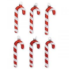 four candy canes are hanging on the wall