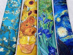 five ties with different paintings on them