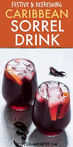 two glasses filled with red liquid sitting on top of a white table next to each other