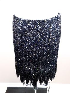 "This is a fun vintage skirt fully embellished with sequins and glass beading. It's in excellent condition! Measurements: Waist - 29\" Hips - 38\" Length - 14-19\" All of my items come from a smoke-free and pet-free home. If you would like more info or have any questions, please don't hesitate to ask!" Fitted Party Bottoms With Beaded Fringe, Glamorous Mini Skirt With Rhinestone Fringe For Party, Mini Skirt With Rhinestone Fringe For Night Out, Embellished Evening Pencil Skirt, Embellished Evening Skirt, Glamorous Embellished Pencil Skirt, Glamorous Party Skirt With Rhinestone Fringe, Embellished Skirt For Party Season, Fitted Rhinestone Mini Skirt For Evening