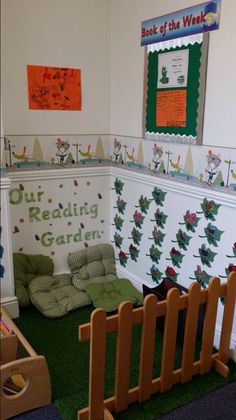 the children's play room is decorated in green and white