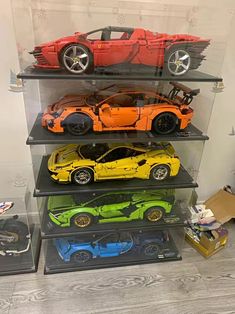 a display case filled with assorted toy cars