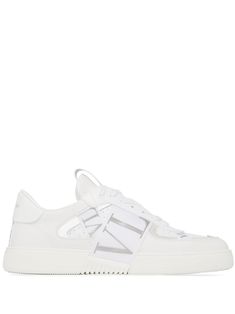 White/silver-tone leather metallic VL7N low-top sneakers from VALENTINO GARAVANI featuring metallic effect, front lace-up fastening, round toe, perforated detailing, logo patch at the tongue, branded heel counter, flat rubber sole and signature VL7N print at the upper. Designer White High-top Sneakers With Logo, Designer White High-top Sneakers With Embossed Logo, Luxury White High-top Sneakers With Logo, Designer White Sneakers With Embossed Logo, Designer White Sneakers With Perforations, Designer White Sneakers With Logo, Luxury Low-top Sneakers With Perforations, Luxury Low-top Custom Sneakers With Perforations, Luxury Custom Low-top Sneakers With Perforations