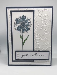 a card with a blue flower on it