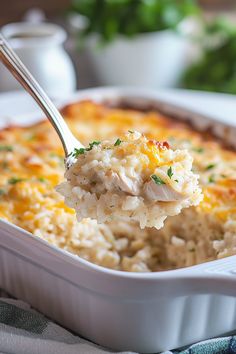 a spoon full of chicken and rice casserole