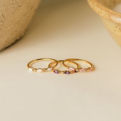 Your ultimate stacking ring has arrived! Our Triple Marquise Birthstone Ring allows you to customize to the stone you want. With delicate CZ Diamond gemstones in between each marquise birthstone, this ring shines with even more sparkle. Material: High Quality Solid 925 Sterling Silver Finish: Sterling Silver ∙ 18K Gold ∙ Rose Gold Featuring a ~1mm Dainty Ring Band with three ~3.5 x 2mm Marquise Gemstones and ~1mm Round CZ Diamond Stones Part of our Birthstone Collection The OPAL Marquise Ring in Three Stone Birthstone Ring, Marquise Gemstone Stackable Promise Rings, Stackable Marquise 14k Gold Rings, Marquise Gemstone Stackable Rings For Anniversary, Anniversary Marquise Stackable Gemstone Rings, Marquise Gemstone Stackable Rings Gift, Dainty Stackable Marquise Cut Rings, Dainty Marquise Gold Stackable Rings, Gold Marquise Stackable Rings, Dainty Style