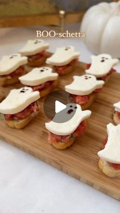 there are many small sandwiches with ghost faces on them