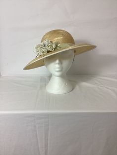 Vintage 1960s does 40s straw summer sunhat with flower and ribbon romantic #VD Natural colour  Fine woven straw with detailing 100% Sisal  Decorative flower detail  Cream ribbon around crown Retro 40s romantic style Oval shaped brim Chin strap to secure Pretty vintage ideal for summer, holidays, weddings, the races etc Perfect for current romantic, boho and cottagecore trends Made in England No label  Size: 55cm Condition:  Good vintage condition.  Please keep in mind that our items are vintage Summer Straw Hat With Ribbon For Spring, Short Brim Boater Hat With Ribbon For Garden Party, Brimmed Boater Hat With Ribbon For Garden Party, Short Brim Sun Hat With Ribbon For Garden Party, Curved Brim Sun Hat With Ribbon For Garden Party, Kentucky Derby Boater Hat With Ribbon, Kentucky Derby Boater Hat With Ribbon For Garden Party, Adjustable Straw Hat With Ribbon For Garden Party, Ribbon Hat For Kentucky Derby Garden Party