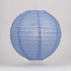 a blue paper lantern hanging from a string