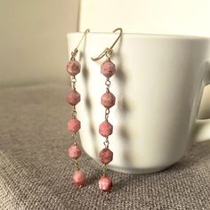 These pink rhodochrosite earrings created by Jewelry By Carmal are made of:  pink rhodochrosite gemstones, gold filled:  earring hooks and findings.  These earrings measure 2 1/2 inches in length. We also offer free standard shipping within the United States. Our jewelry is unique and custom designed. We would love to assist you with any custom orders or needs for those special occasions! Please see other items in our shop: www.etsy.com/shop/jewelrybycarmal. Handmade Pink Jewelry For Everyday Wear, Handmade Pink Everyday Jewelry, Handmade Rose Quartz Jewelry For Everyday, Pink Everyday Jewelry With Ear Wire, Pink Faceted Earrings For Jewelry Making, Elegant Jewelry With Natural Rhodonite Stones, Elegant Rhodonite Jewelry For Gifts, Pink Natural Stone Earrings For Gift, Pink Drop Earrings With Natural Stones