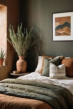 a bed with pillows, blankets and plants in pots on the headboard next to it