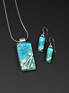 Turquoise and Aqua Glass Pendant and Earring Set by RezinStudios on Etsy https://www.etsy.com/listing/666682328/turquoise-and-aqua-glass-pendant-and Modern Turquoise Glass Jewelry, Artisanal Design, Aqua Glass, Glass Fusion Ideas, Fused Glass Jewelry, Sea Glass Jewelry, Delicate Necklace, Glass Earrings, Glass Set