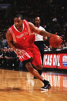 a basketball player dribbling the ball during a game