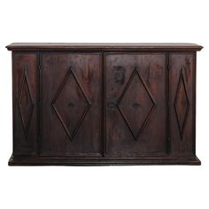 an old wooden cabinet with three doors and diamond designs on the front, against a white background