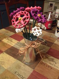 a vase filled with flowers sitting on top of a table