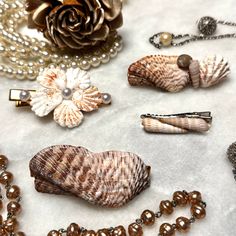 Welcome to our seaside-inspired collection of Shell Hair Clips! 🐚 Perfect for adding a touch of coastal charm to any hairstyle, these exquisite hair clips are a must-have accessory for Bridal Showers, Weddings, Beach-goers, and anyone seeking those quintessential summer vibes. Crafted with love and attention to detail, each hair clip varies in size and are made with natural shells. No two hair clips are alike, making each piece a unique treasure to be cherished. Please feel free to send me a me Sea Shell Hair Accessories, Wedding Hair Beach, Seashell Hair Accessories, Seashell Hair, Weddings Beach, Beachside Wedding, Wedding Barrettes, Hair Summer, Hair Wedding