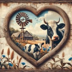 a painting of two cows in a heart shaped frame with a windmill on the other side