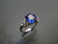 a blue and white ring sitting on top of a table