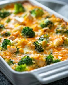 a casserole dish with broccoli and chicken in it on a table