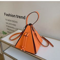 This Is A Beautiful Luxury Women Handbag Autumn Winter 2024 Bag Size 20x10x20 Cm Color Brown Orange Crossbody Bucket Bag, Orange Bucket Bag With Removable Pouch For Shopping, Orange Bucket Bag With Detachable Handle, Orange Shopping Bag With Top Carry Handle, Trendy Large Capacity Orange Bags, Large Capacity Orange Bag For Shopping, Spring Bucket Bags For On-the-go, Modern Orange Double Handle Shoulder Bag, Orange Bag With Top Carry Handle For On-the-go