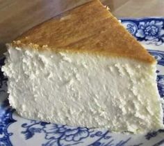 a piece of cheesecake on a blue and white plate