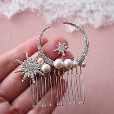 Small hair  comb with stars and moon  Prom hair jewelry  Great for wedding or other celebration Color: rhodium-silver/clear/ivory Measurements: approx 2.5 inches Materials: metal findings, faux pearls,wire, hair comb. PACKAGING: no gift packaging or with gift packaging option available(depends on current stock). SAME STYLE in GOLD: https://www.etsy.com/uk/listing/1402047082/gold-celestial-star-hair-comb-wedding?click_key=c85cf6ee6731b956d8b70d4caec5b75d6369d7f1%3A1402047082&click_sum=18683a1e&re Star Headpiece, Prom Hair Jewelry, Hair Accessories Green, Leaf Headpiece, Bridesmaid Hair Pins, Prom Hair Accessories, Celestial Wedding, Bridal Hair Piece, Gold Hair Accessories