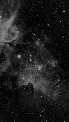 black and white photograph of the night sky with stars in it, as seen from space