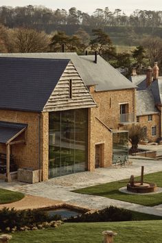 Double height glass wall to a barn door opening Shed Cabin, Manor Farm, Holiday Hotel, Hotel Luxury, Farm Buildings, Country Inn, Brick Facade