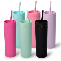 four different colored tumblers with straws in one cup and two on the other