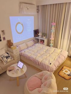 a bed room with a large screen on the wall