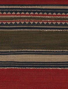 a red, brown and blue striped rug with horizontal stripes on the bottom half of it