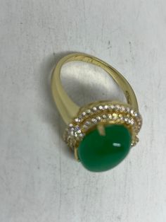 Vintage Lucky Green Nephrite Jade Gold Filled Cocktail Ring Large green nephrite jade gold filled Vintage ring, does not tarnish Size 5.5, 6, 7, 7.5, 8.5 All rings are shipped free in the US in a nice gift box. Check out our over a THOUSAND great reviews Engraving is $4 per letter and is not always perfect depending on the piece. It can take a few days if the jeweler is busy. This is payable to Paypal Judithsltd@gmail.com Gold Oval Chrysoprase Emerald Ring, Gold Jade Ring With Polished Finish, Oval Gold Emerald Ring With Stone Setting, Gold Jade Cabochon Rings, Gold Rings With Jade Cabochon, Fine Jewelry Gold Jade Rings, Gold Jade Rings In Fine Jewelry Style, Fine Jewelry Gold Rings With Jade, Gold Chrysoprase Ring