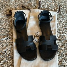 Black Hermes Santorini Sandals. Size 36 1/2. True To Size. Comes With Dustbags. Purchased From Hermes Miami Hermes Shoes, Santorini, Women's Shoes Sandals, Black Shoes, Shoes Sandals, Sandals, Women Shoes, Leather, Black