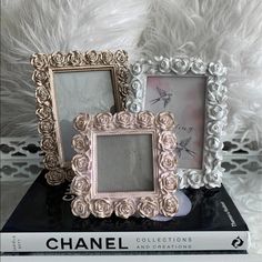 two frames sitting on top of a book