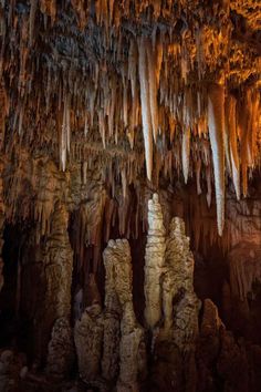 the inside of a cave with stalate formations