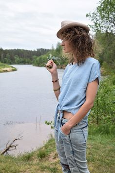 "Excellent denim blouse for your midsummer nights. It is not a mistake - buttons are on the back! Size: label says S, seems like women's (S) MEASUREMENTS: Length: 57 cm/ 22\" (without ties) Shoulder to shoulder: 50 cm/ 20\" Chest: 116 cm/ 46\" Condition: excellent Fabric: Lyocell Brand: unknown * Wash at temperature not higher than 30oC / 86oF Model wears: UK 8/ EU 36/ US 4 Model's height: 175 cm/5'7\" You can find more similar shirts here: https://www.etsy.com/shop/OnTheRoadStore?section_id=239 Short Sleeve Denim Top For Summer, Summer Denim Blue Top With Short Sleeves, Summer Relaxed Fit Denim Blue Denim Top, Light Wash Denim Top For Summer Day Out, Light Wash Cotton Tops For A Day Out, Trendy Light Wash Summer Blouse, Summer Chambray Denim Shirt, Light Wash Summer Beach Top, Light Wash Top For Beach In Summer