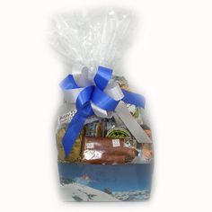 a gift bag filled with chocolates, nuts and other items for someone's special occasion