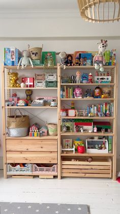 a child's room with toys and bookshelves