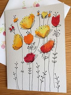 two cards with watercolor flowers on them, one is red and the other is yellow