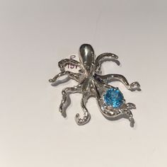 Sterling Silver Octopus Pendant Slider With Tentacles Holding Genuine Blue Topaz P7529/S/Gen/ Bt Octopus Pendant, Jewelry Sterling Silver, Boutique Jewelry, Silver Blue, Octopus, Blue Topaz, Belly Button Rings, Womens Jewelry Necklace, Sterling Silver Jewelry