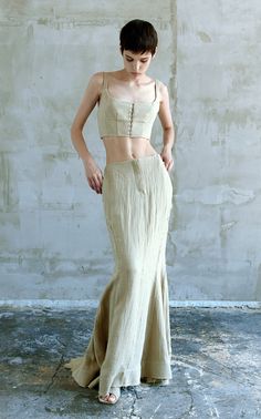 Founded in 2021 by Ukrainian designer Tetyana Chumak, TG Botanical seeks to provide an environmentally-conscious, modern wardrobe where nature and technology are in tune.The 'Lucretia' is a square neck, corset crop top crafted from a nettle-flax blend with a breathable canvas texture. It pairs perfectly with [this skirt](https://www.modaoperandi.com/women/p/tg-botanical/shailene-maxi-skirt/614566) from the collection. Mermaid Skirt Outfit, Corset Skirt Outfit, Nature Aesthetic Outfit, Corset Fashion Outfits, Nature And Technology, Modern Skirt, Speculative Design, Maxi Skirt Style, Corset Skirt