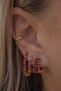 For the babes who love to sparkle, the Ruby Red Pave Hoop is a must. Red crystals cover this hoop and shine just right. 14mm x 3mm Gold plated over brass and finished with an IP tarnish resistant coating Surgical steel posts for sensitive ears Nickel and cadmium free ﻿by LUV AJ Ruby Ear Piercings, Red Prom Earrings, Red Earring Stack, Ear Inspo Jewelry, Red Piercing, Ruby Red Jewelry, Dream Piercings, Ear Peircings, Earring Stack