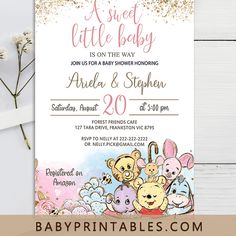 winnie the pooh baby shower party with gold glitter on it and pink, white and blue