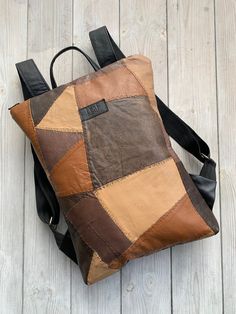 "Brown Light Leather Backpack, Upcycled Leather Backpack LeaF leather backpacks are made from up-cycled materials. All bags are one of a kind and unique. Minimalist design leather backpack fits 15\" laptop.  |WIDTH: 32 cm (12.6 in).  |HEIGTH: 42 cm (16.5 in).  |SHIPPING: ready to ship in 1-2 days. If you have any questions or special requests, please drop us a message. We are happy to help. For more - jump in here: www.etsy.com/shop/LFantasy Any written or visual information in this page can be Leather Laptop Bag Backpack With Leather Handles, Leather Laptop Backpack With Leather Handles, Leather Rectangular Backpack With Leather Handles, Rectangular Leather Backpack With Leather Handles, Faux Leather Backpack For Daily Use, Faux Leather Backpack With Leather Backing, Faux Leather Soft Backpack, Brown Faux Leather Standard Backpack, Everyday Brown Backpack With Leather Patch