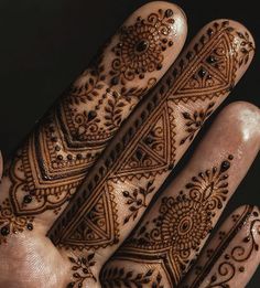 the hands are decorated with intricate designs