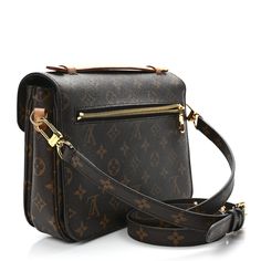 This is an authentic LOUIS VUITTON Monogram Pochette Metis. This chic handbag is finely crafted of classic Louis Vuitton monogram toile canvas. The bag features a vachetta cowhide leather handle, an optional, adjustable monogram coated canvas shoulder strap, and a rear zipper pocket. The crossover flap opens with a polished gold tone S-lock to a partitioned brown microfiber interior. Chic Handbags, Authentic Louis Vuitton, Leather Handle, Cowhide Leather, Crossover, Louis Vuitton Monogram, Zipper Pocket, Shoulder Strap, Louis Vuitton